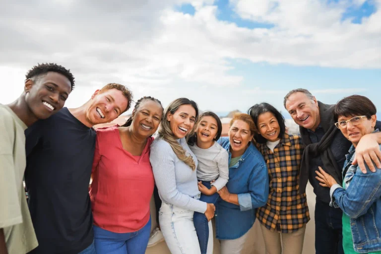 group-of-multigenerational-friends-smiling-in-fron-2025-02-24-09-46-35-utc